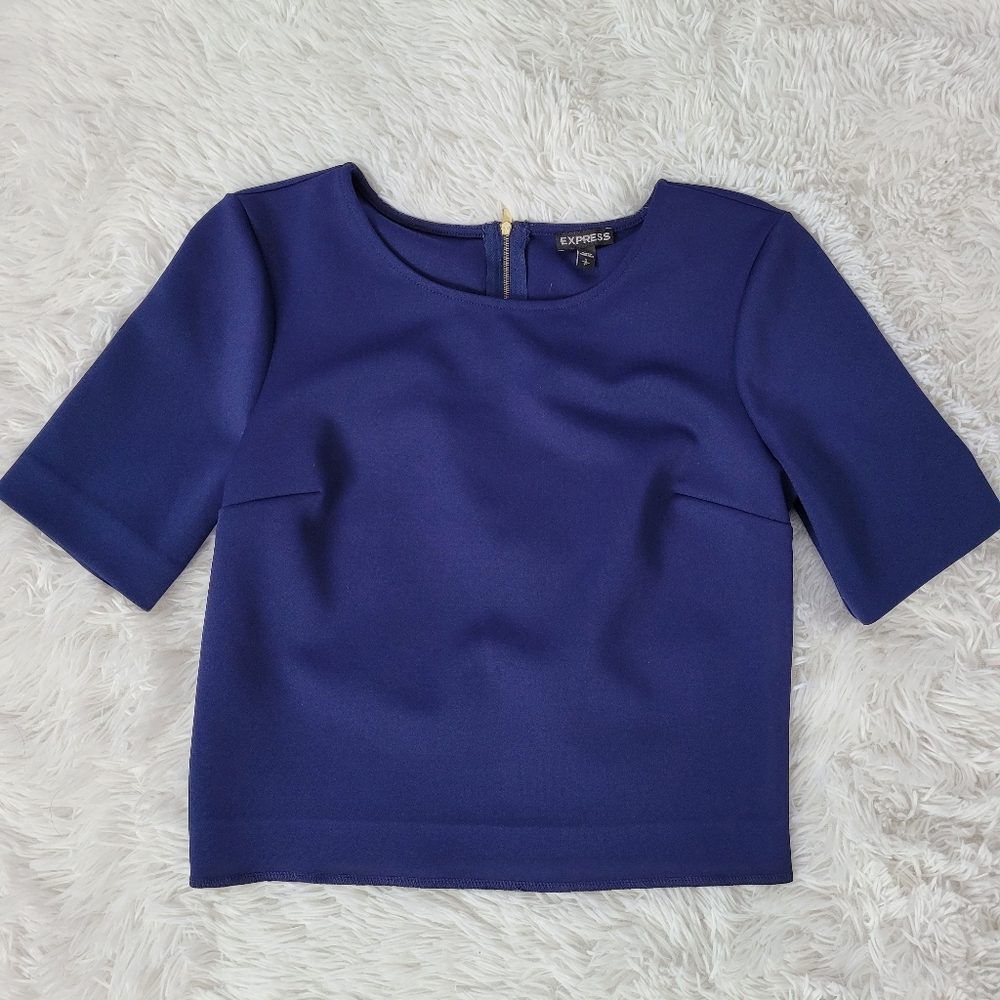 Express Navy Blue 3/4 sleeve top with zipper in back. Good condition, size small
